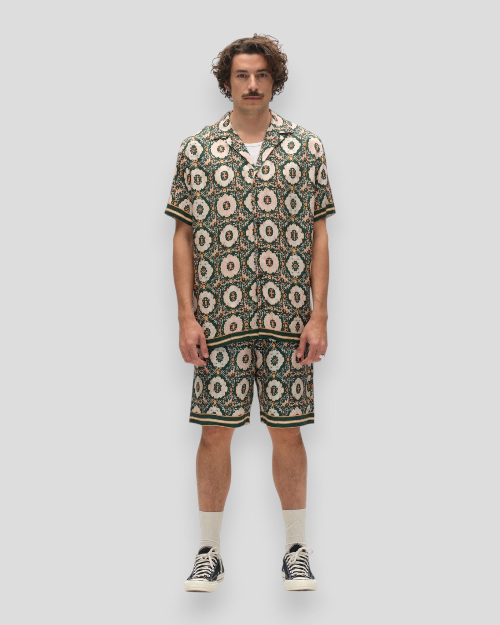 Grønne Tommi Oro shorts med mønster fra Gabba, vises med detaljeret tekstur og afslappet pasform.