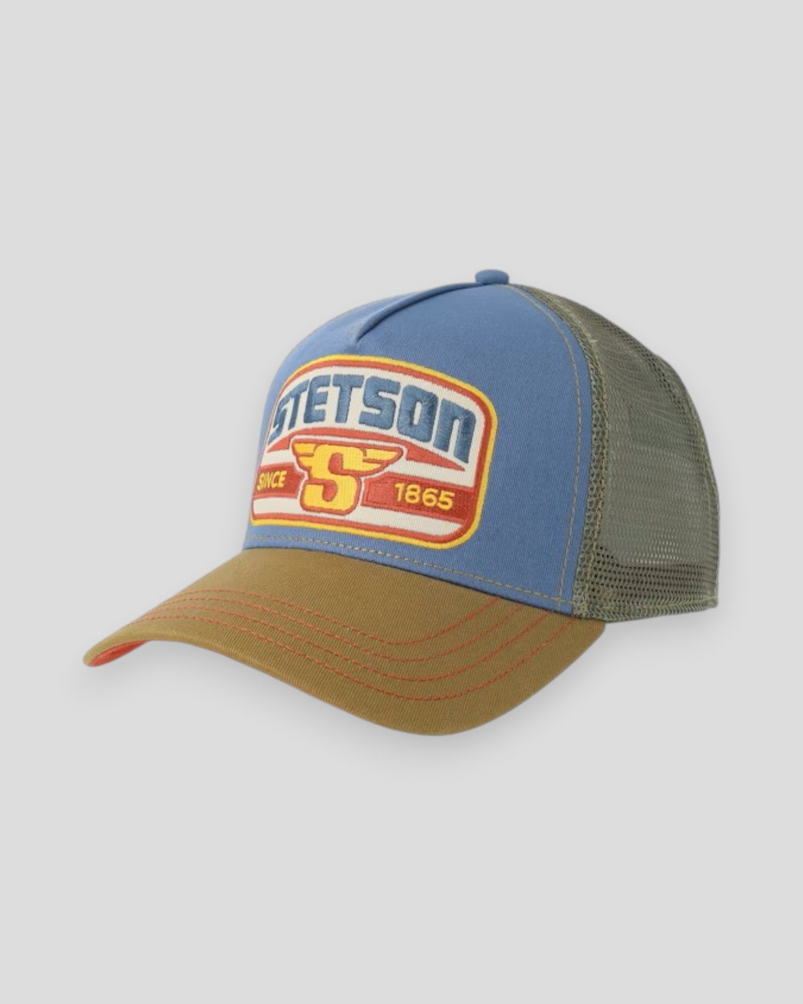 Stetson blue and brown trucker cap with "Since 1865" wing embroidery, adjustable mesh back and structured front panel.
