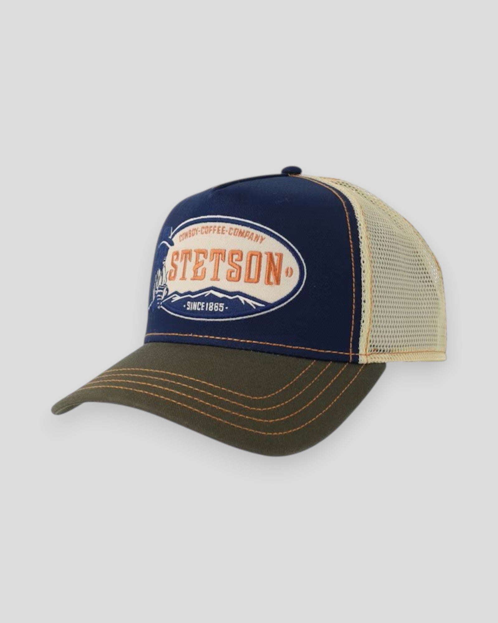 Stetson cowboy trucker cap in blue and olive with mesh back and curved brim, casual western style.