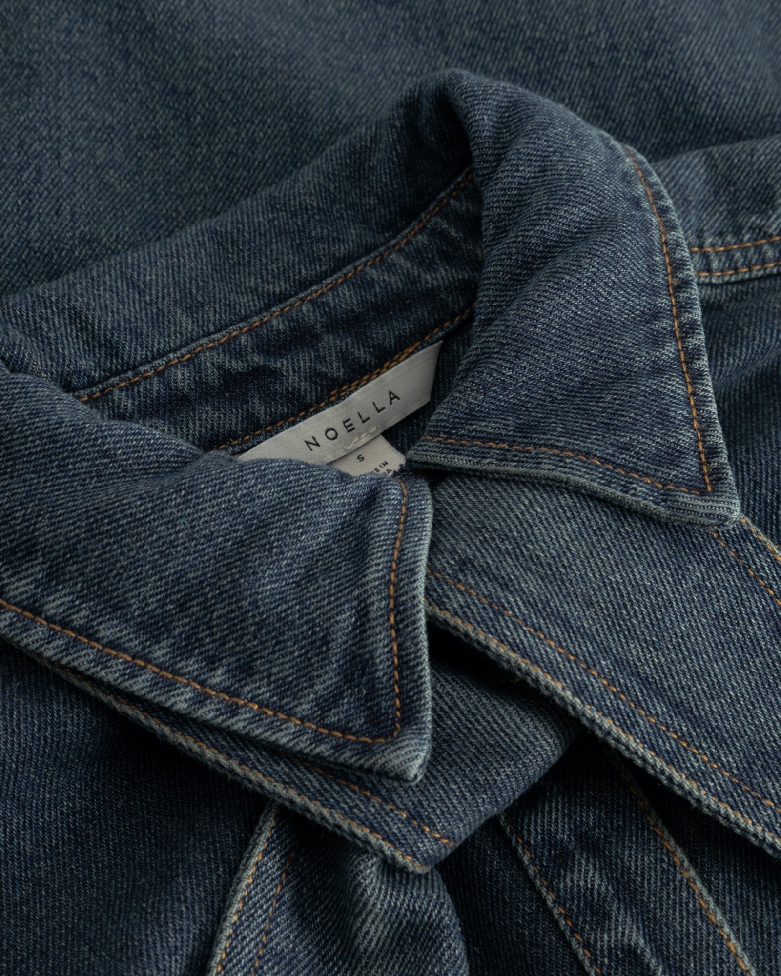 Noella N-Lirinnah women's shirt in vintage blue wash with a casual fit and classic collar, displayed on a hanger.