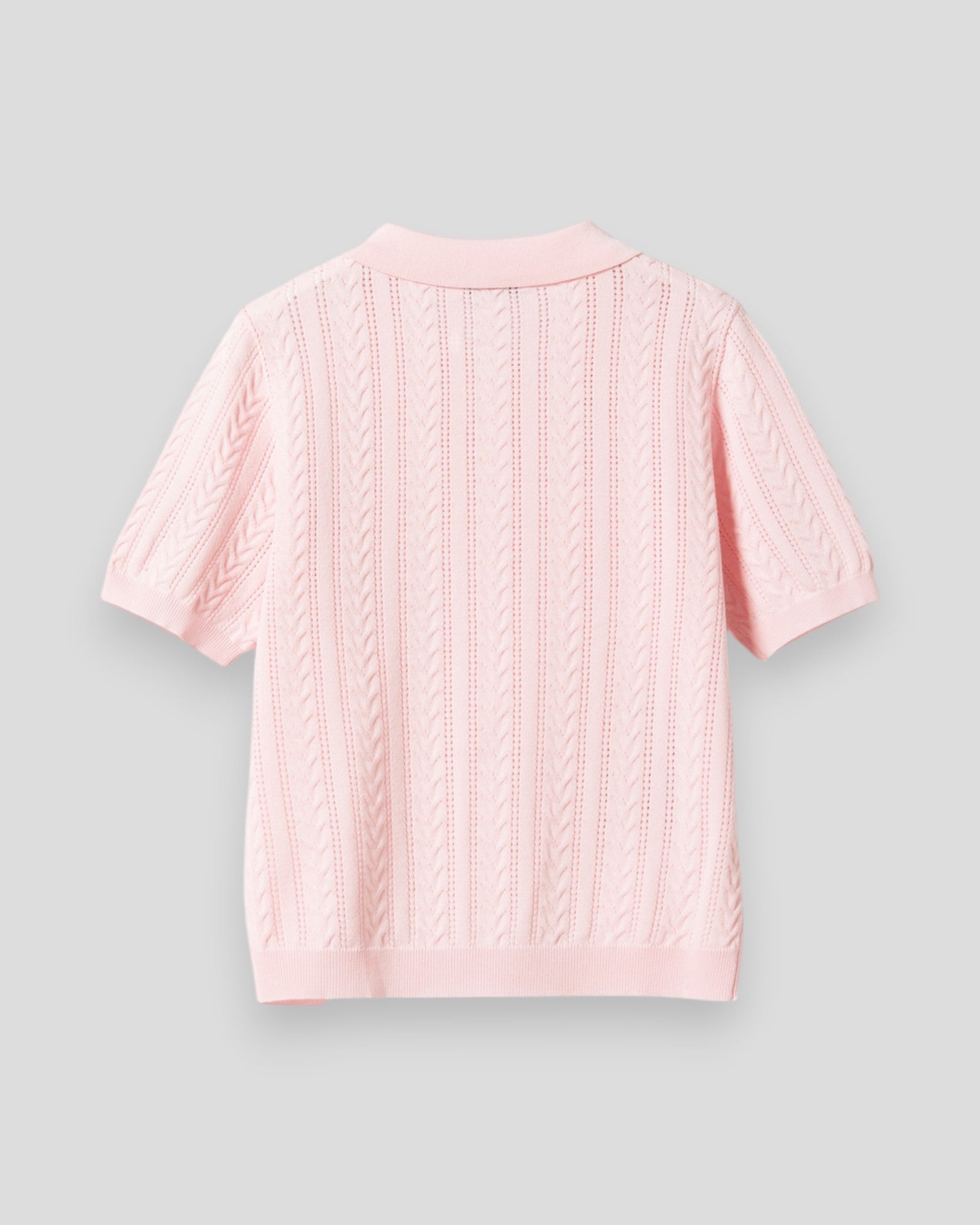 Noella N-Mecca knit polo i baby pink til kvinder, vises med ribbet krave og korte ærmer.