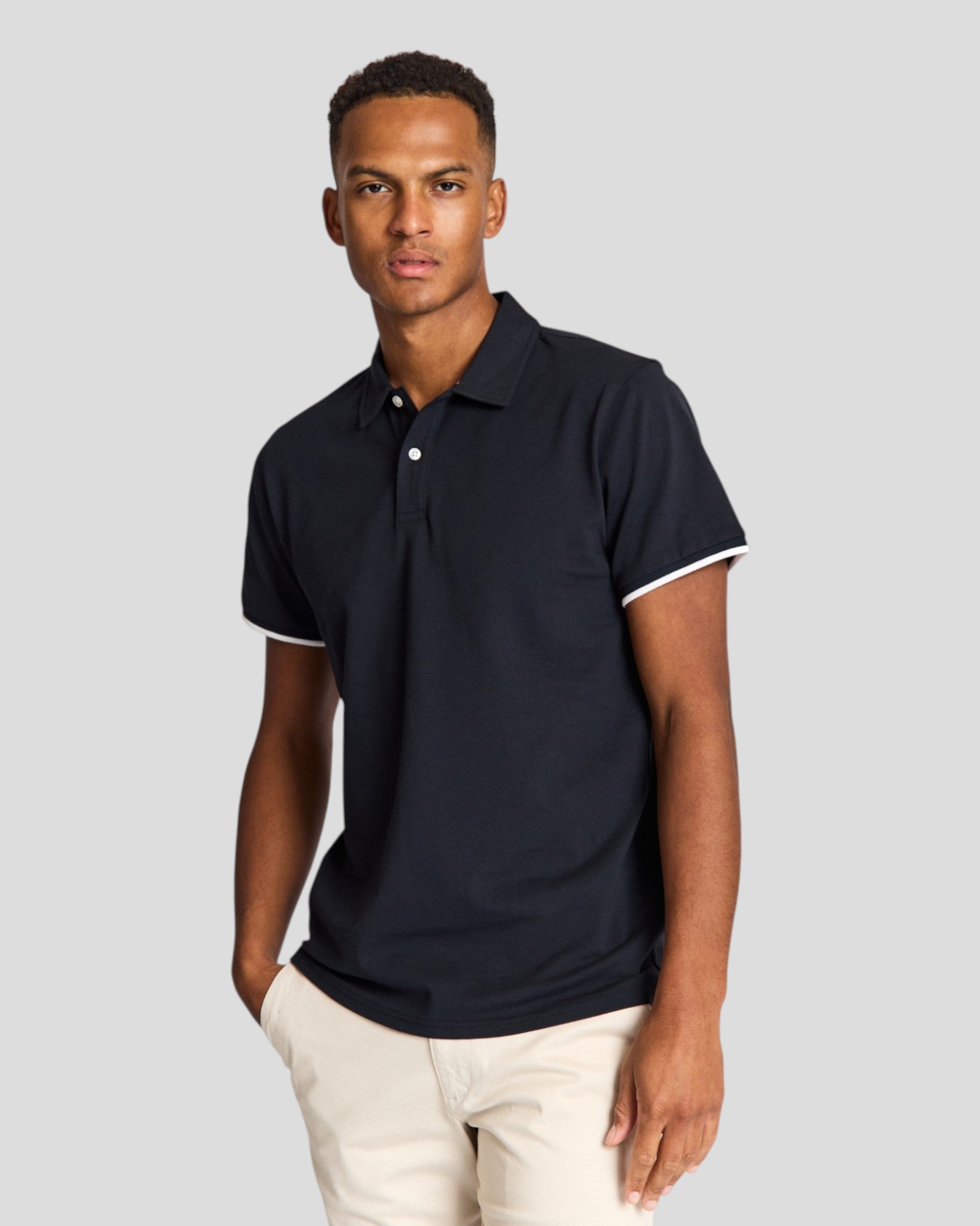 Navy Delos regular fit polo shirt by Bruun & Stengade, featuring a classic collar and short sleeves, laid flat on a neutral background.