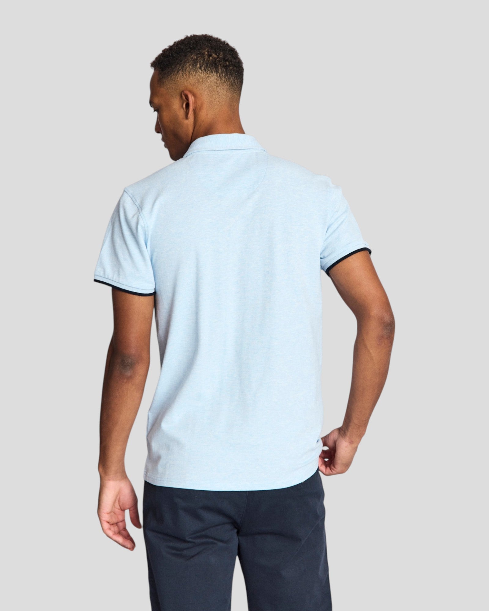 Sky blue Bruun & Stengade Delos regular fit polo shirt displayed on a mannequin, featuring a classic collar and short sleeves.