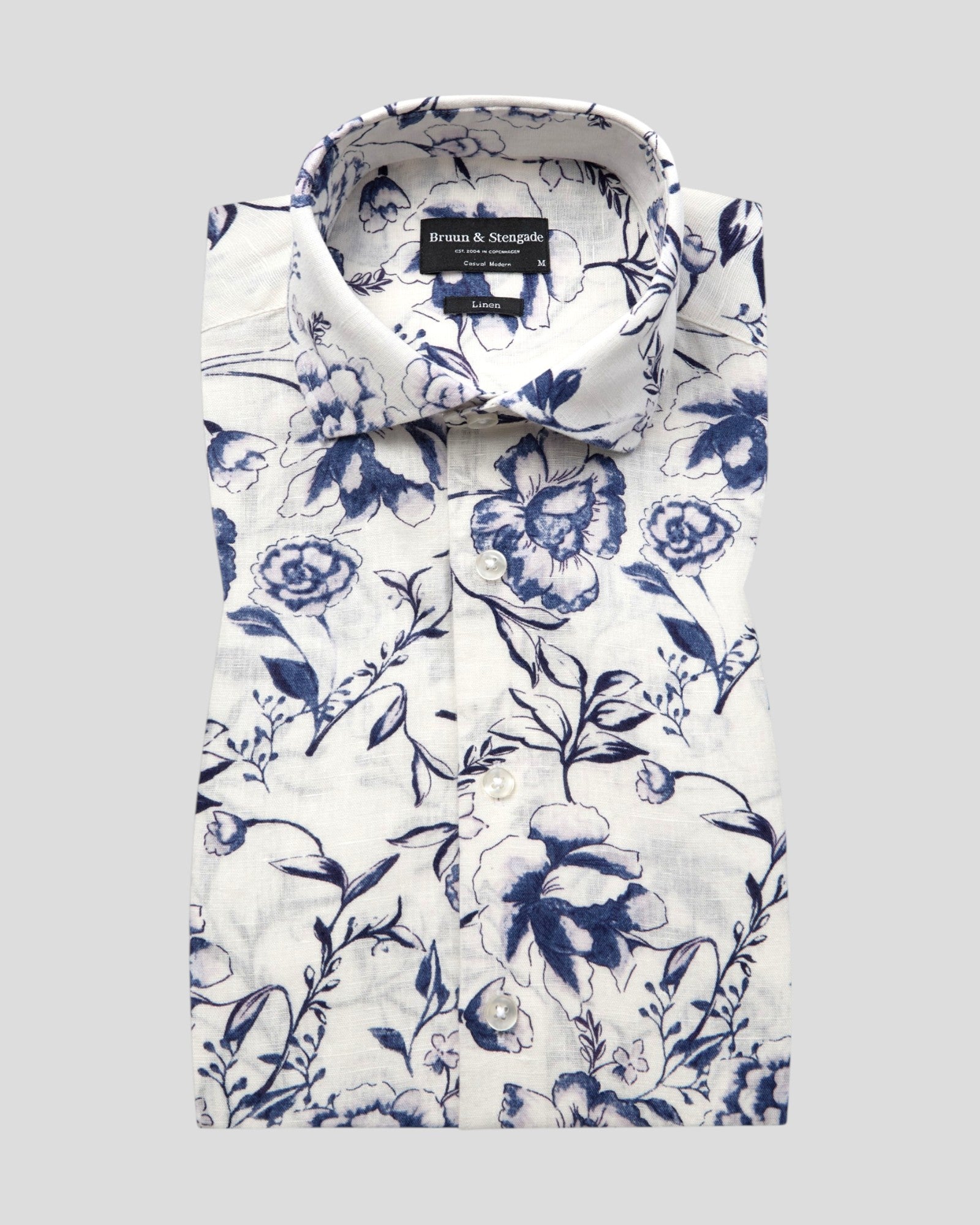 White Mengel casual modern fit shirt by Bruun & Stengade, displayed neatly on a hanger against a plain background.