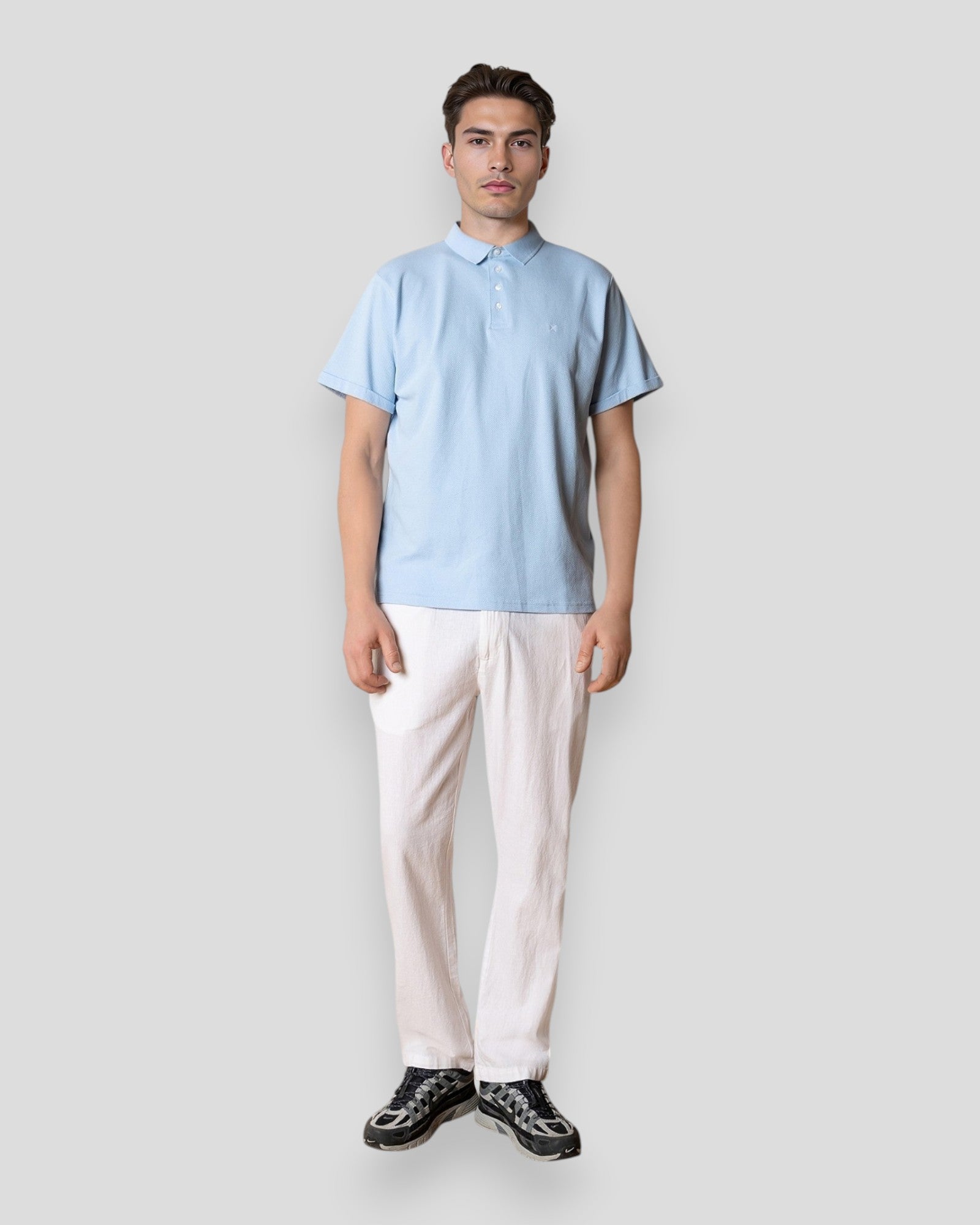 Light blue Silkeborg Stretch Polo by Clean Cut Copenhagen, showing the fitted polo shirt with a collar and short sleeves.