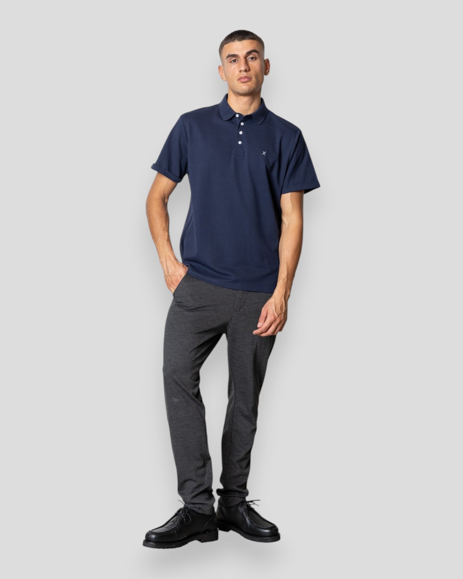 Navy Silkeborg Stretch Polo shirt by Clean Cut Copenhagen, showing the fitted polo with collar and short sleeves.
