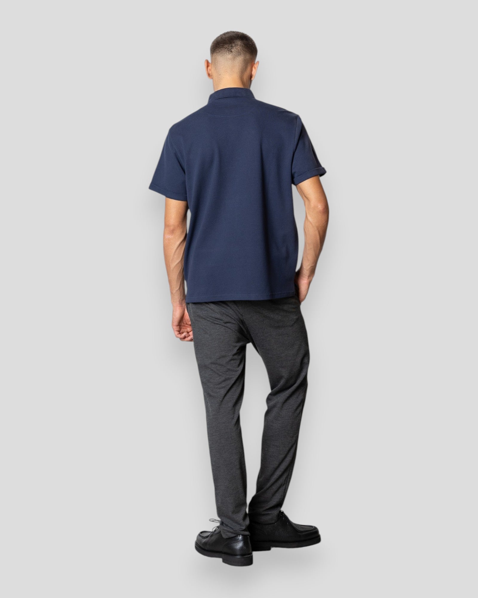 Navy Silkeborg Stretch Polo shirt by Clean Cut Copenhagen, showing the fitted polo with collar and short sleeves.