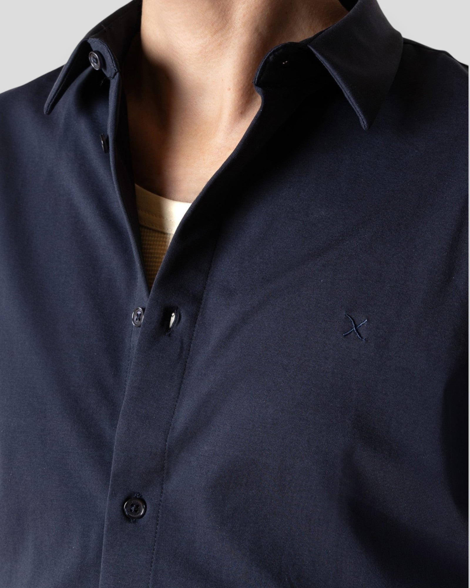 Navy formal stretch shirt by Clean Cut Copenhagen with a classic collar and long sleeves, displayed on a plain background.