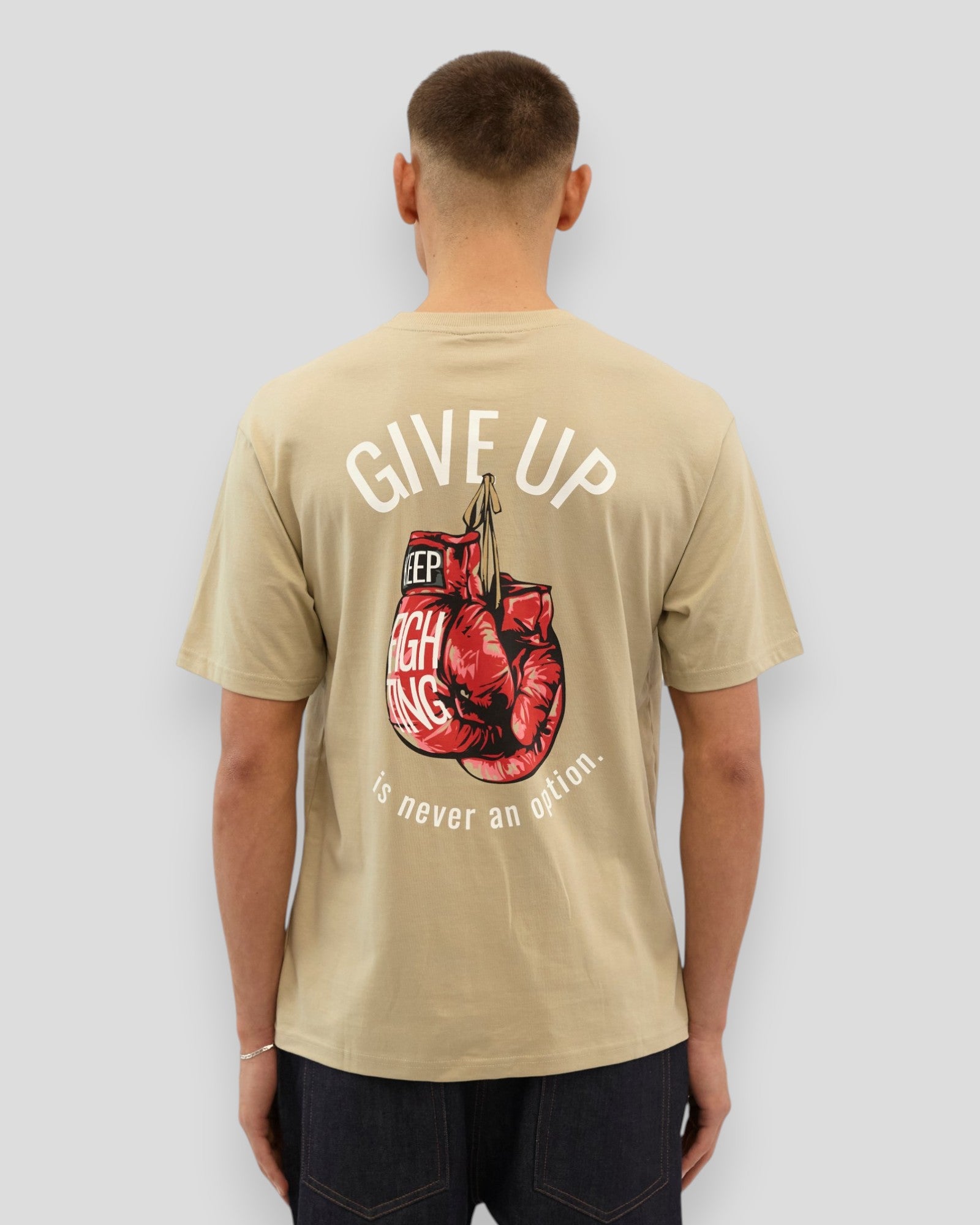 Light grey Everlast Never Give Up Tee displayed on a hanger, showcasing casual athletic style and comfortable fabric.