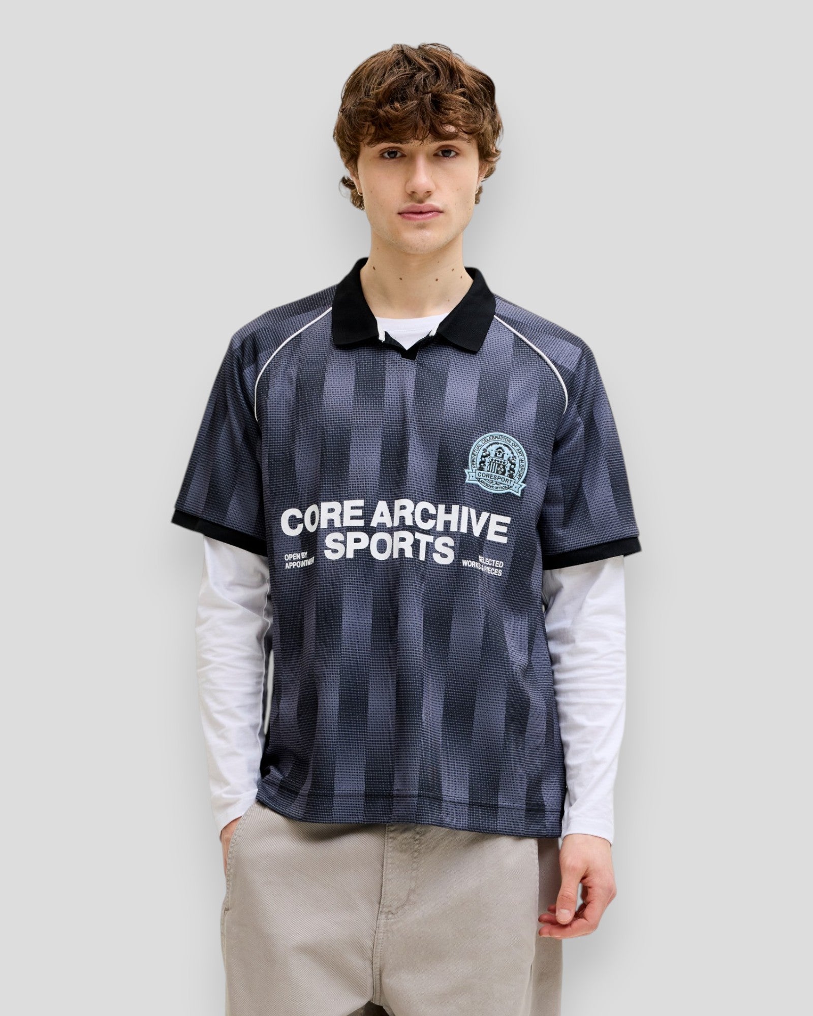 Black Breeze Football AOP Mesh Tee by Jack & Jones, featuring a sporty mesh fabric and football-inspired design.