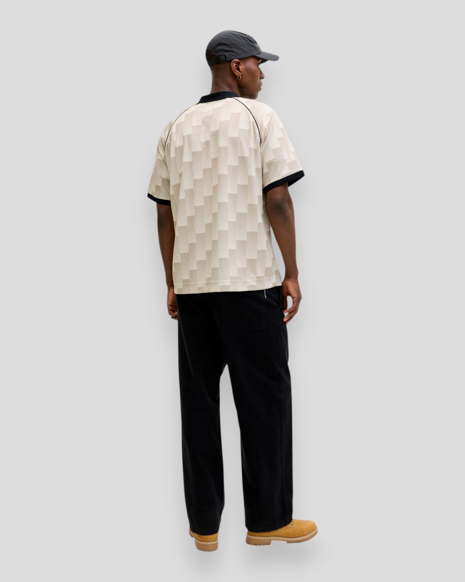 Jack & Jones Breeze Football AOP Mesh Tee SS in sweet corn color, showing lightweight mesh fabric and football-inspired print.