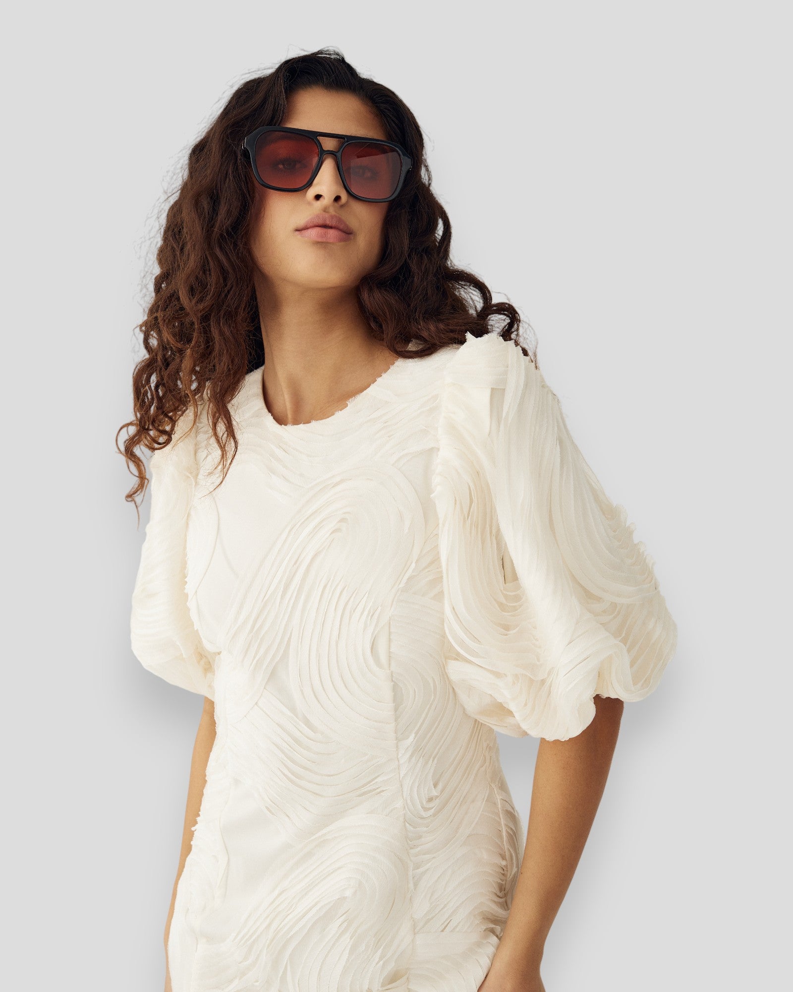 Noella N-Michaela dress in ivory, elegant sleeveless dress with a flowy silhouette and subtle detailing.
