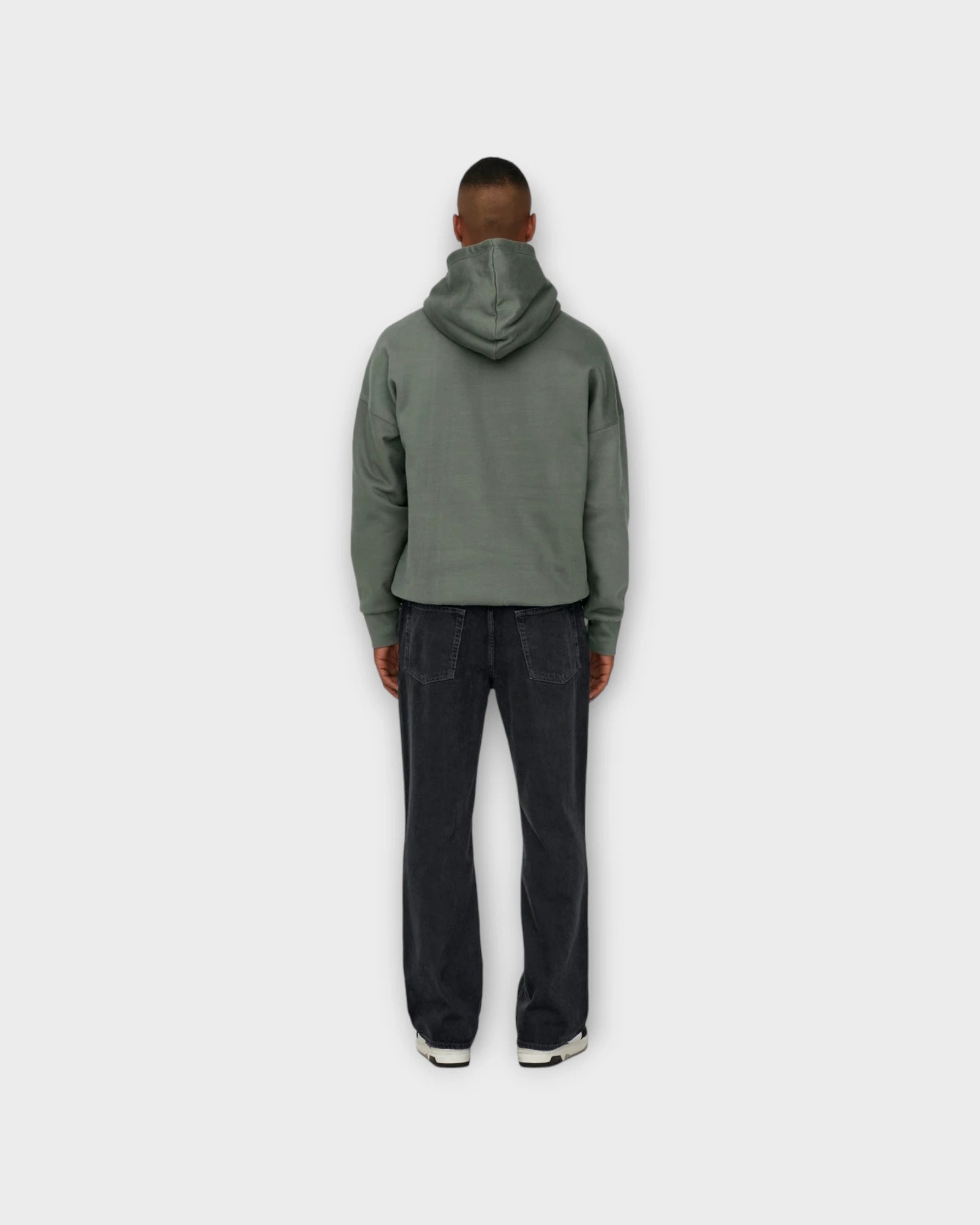 Back view of ONLY & SONS Fade Loose WB 6778 Tai Dnm Noos jeans in washed black denim, showcasing relaxed fit and faded detailing.