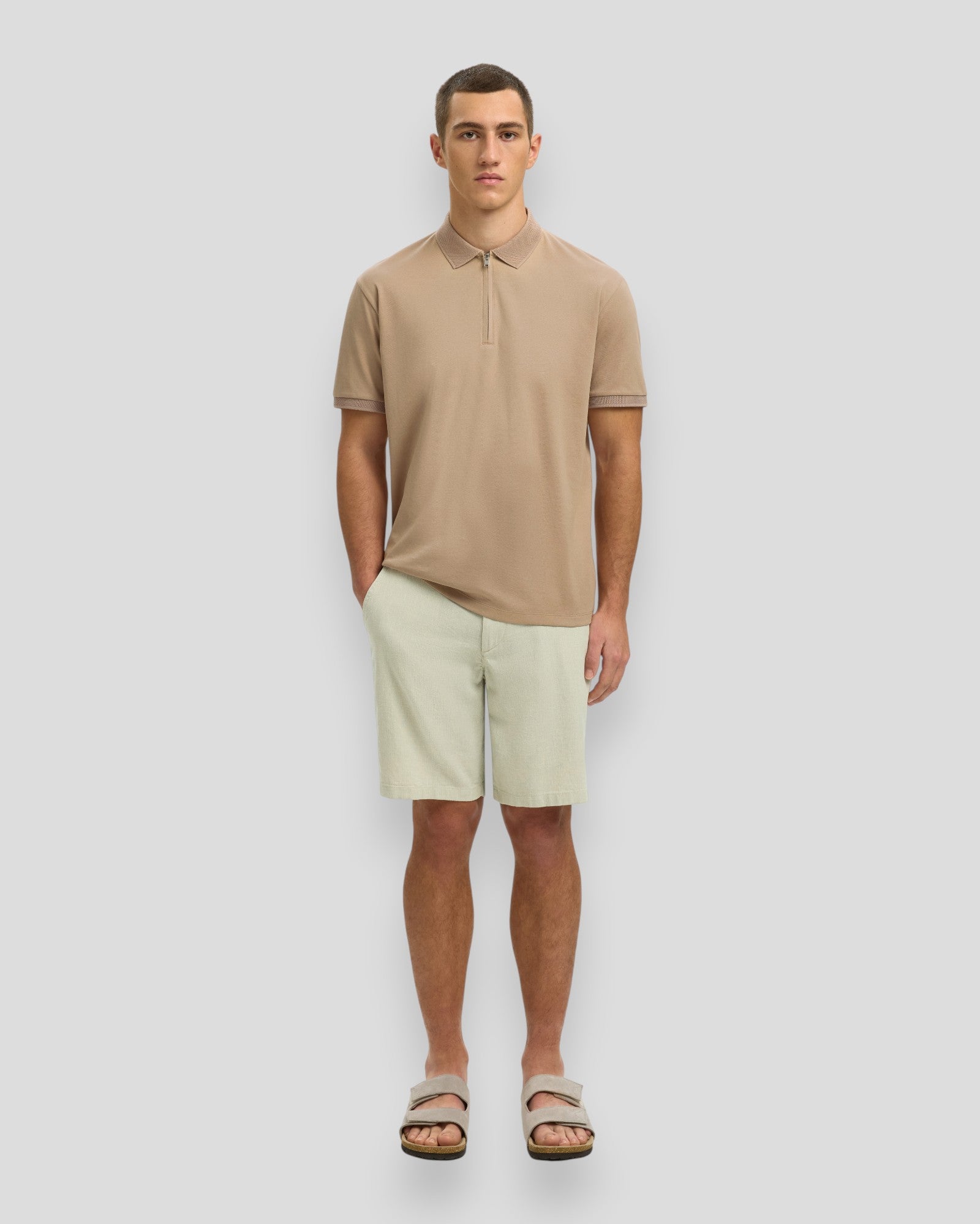 Men's Fave Zip SS Polo by Selected in Savannah Tan, featuring a classic polo shirt with a zip collar and short sleeves.