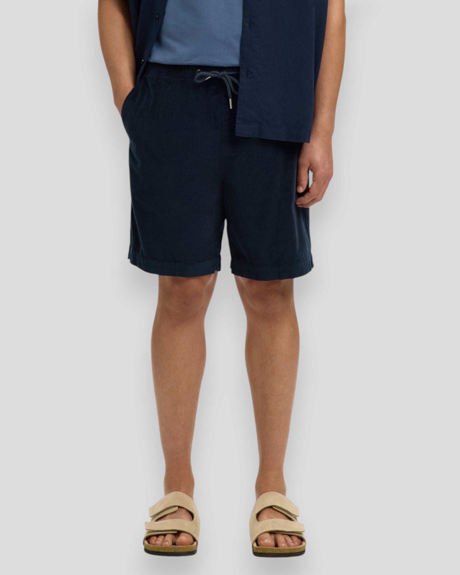 Light blue Jace corduroy shorts by Selected, showing the textured fabric and classic fit on a model.