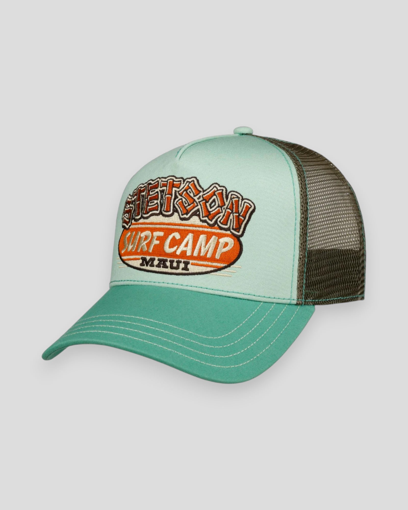 Mint green Stetson Trucker Cap with Surf Camp logo, mesh back, adjustable strap, and curved brim, perfect for casual wear.
