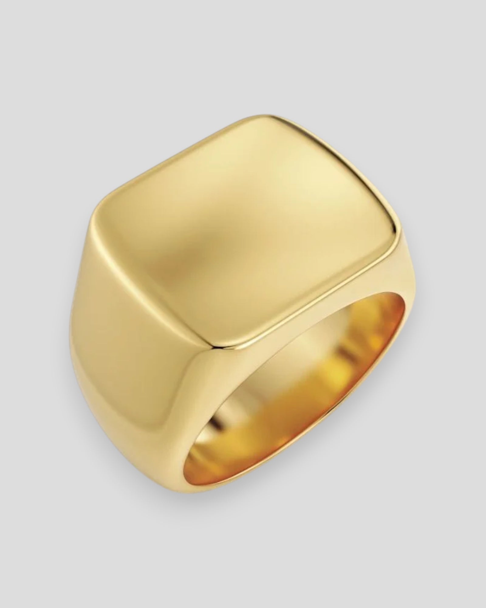 Gold Edblad Ellis Signet Ring for men, featuring a sleek design and engraved surface, displayed on a white background.