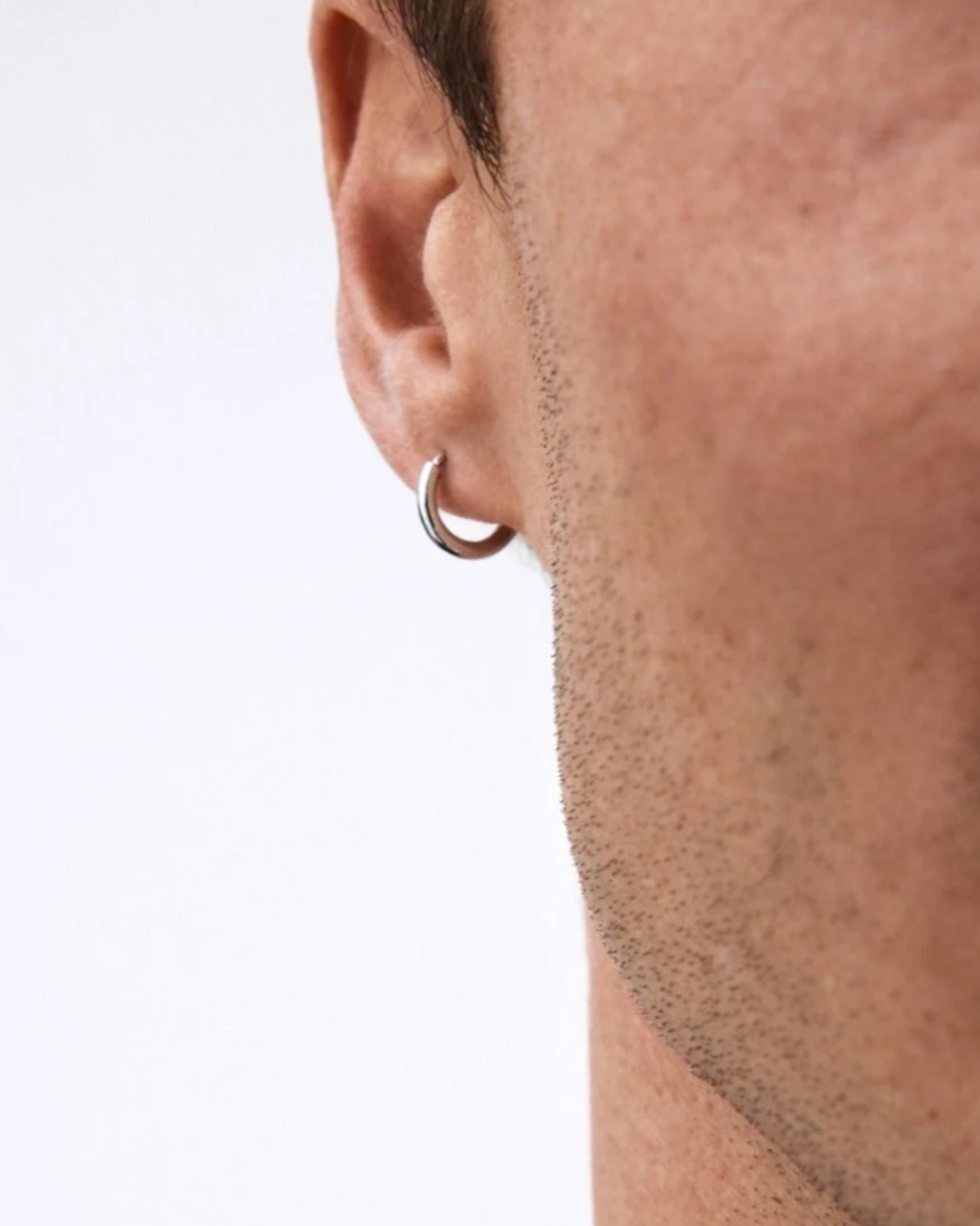 Men's Edblad Kendall Hoops earrings in sleek steel with a polished finish, displayed on a plain background.