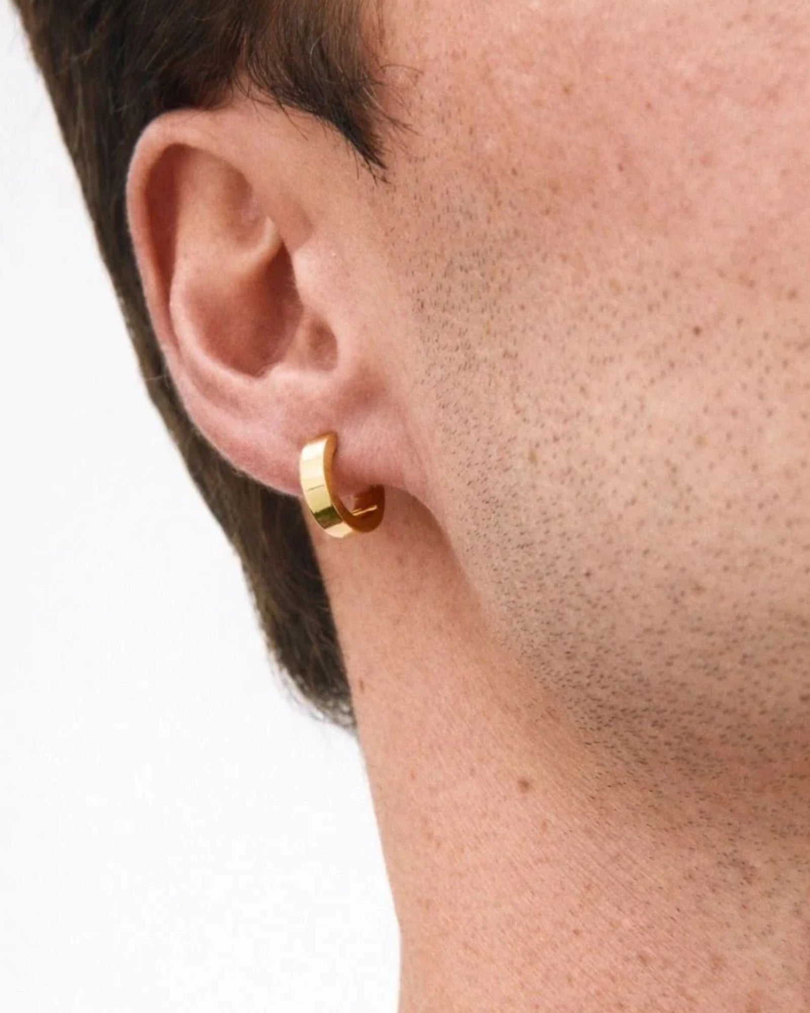Gold men's Sasha Hoops earrings by Edblad, featuring sleek, circular hoop design in shiny gold finish.