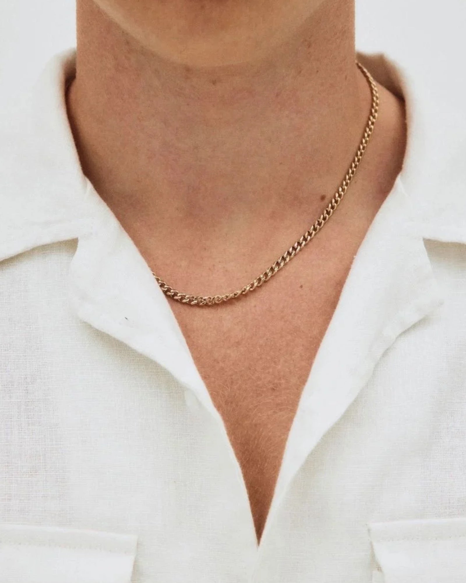 Gold Edblad Riley men's necklace featuring a sleek, modern design with a smooth chain and subtle branding, perfect for everyday wear.