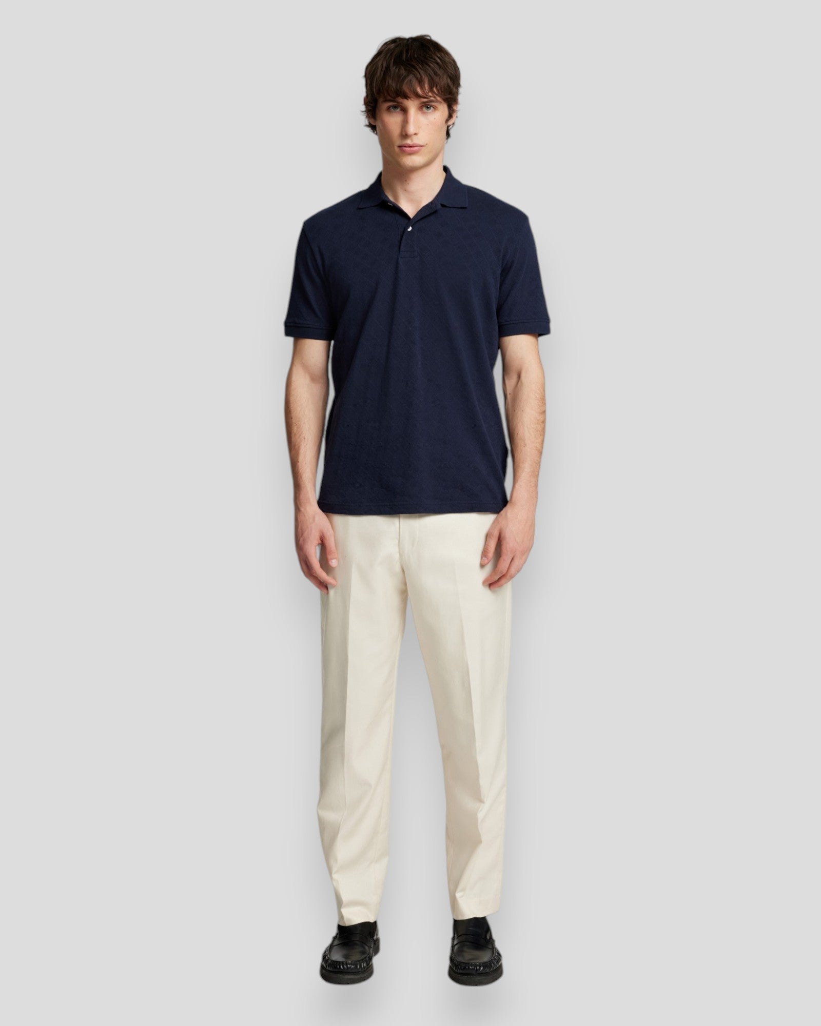 Selected Sky Captain Polo – modelbillede af en polo med karakteristisk jacquardmønster og moderne pasform.