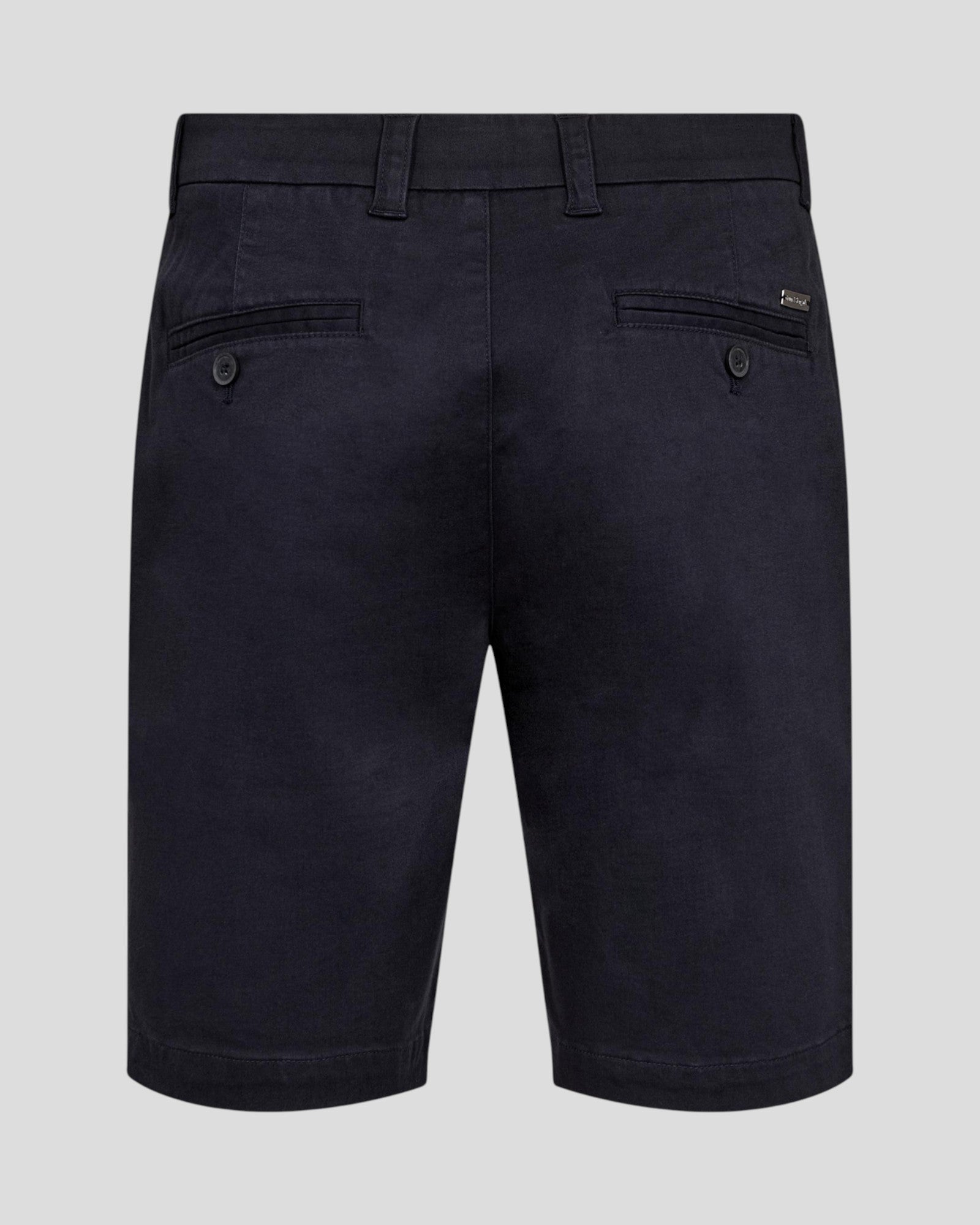 Bruun & Stengade navy Loris regular fit shorts displayed on a hanger with a casual background.