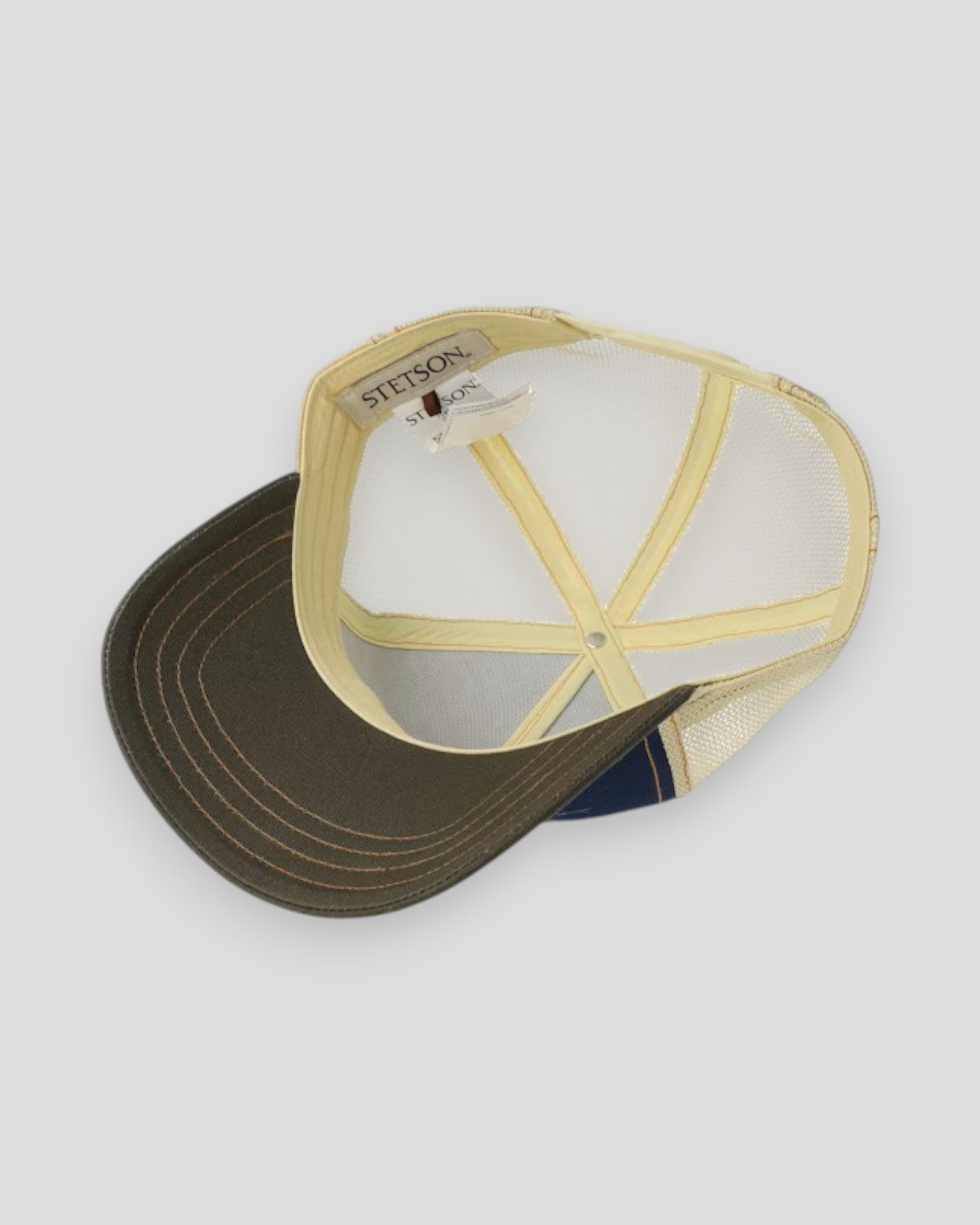 Stetson Trucker Cap Cowboy Coffee in blue and olive with mesh back and curved brim, casual outdoor headwear.