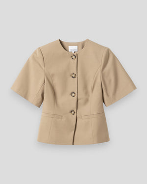 Kvinde bælte blazer i oyster fra Noella, elegant og stilfuld med klassisk pasform og struktureret design.