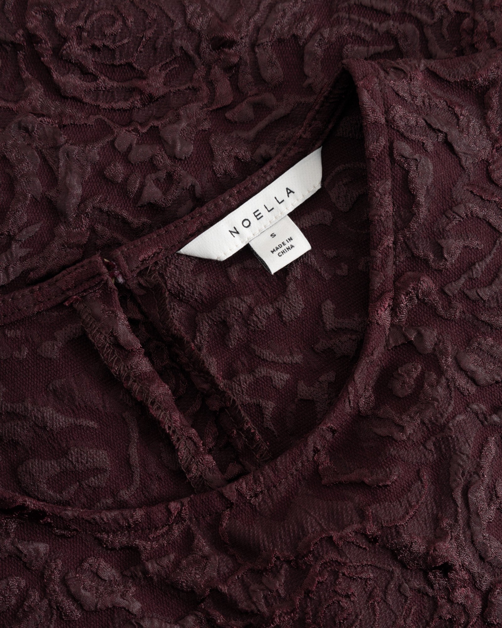 Noella N-Shelly Winetasting women's blouse featuring a stylish design and comfortable fit, shown in a close-up image.