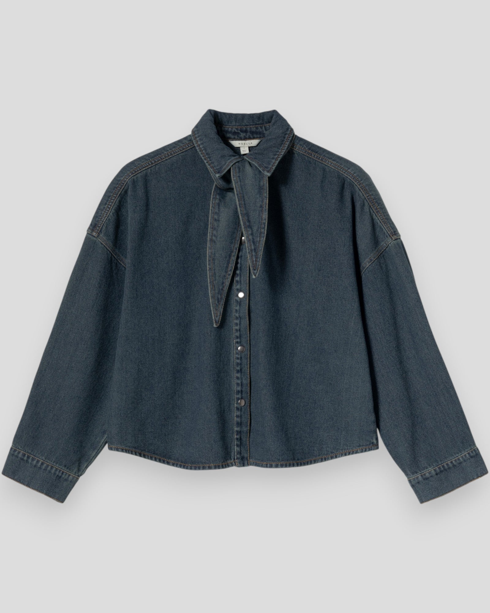 Noella N-Lirinnah women's shirt in vintage blue wash with a relaxed fit and classic collar, displayed on a hanger.