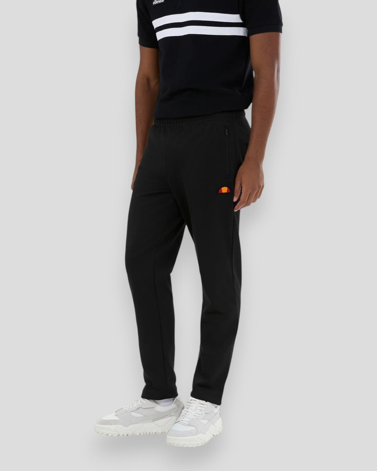 Ellesse Bertoni track pants i sort med elastisk talje og sporty detaljer