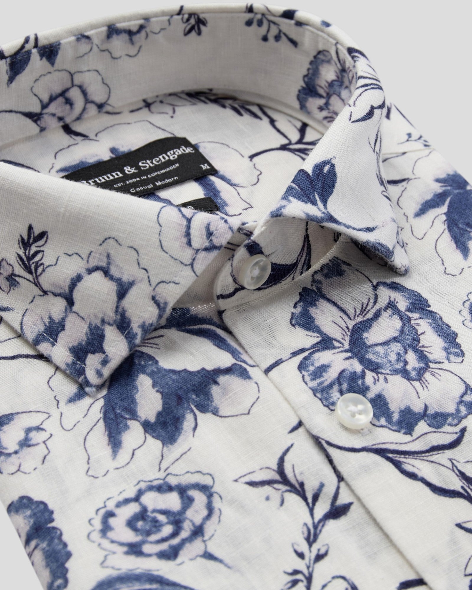 White Mengel casual modern fit shirt by Bruun & Stengade, displayed on a hanger against a neutral background.