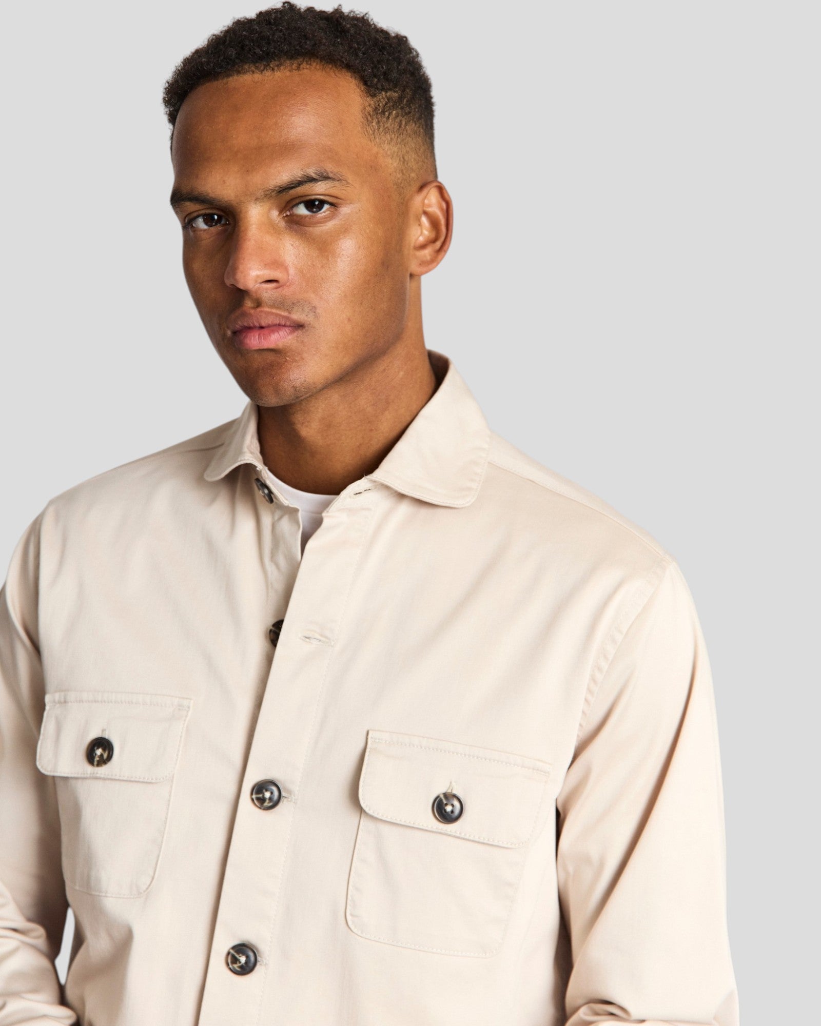 Bruun & Stengade Rocco regular fit overshirt in neutral fabric, shown with button-up front and collar detail.