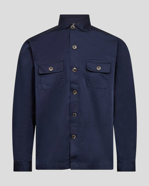 Navy Bruun & Stengade Rocco regular fit overshirt made of durable fabric, displayed on a hanger with button closure and chest pockets.