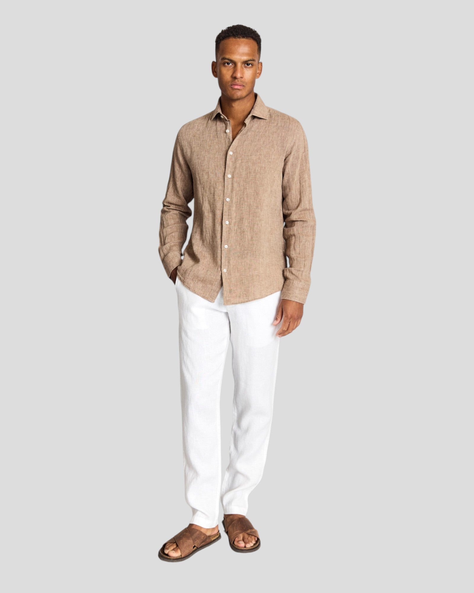 Bruun & Stengade Tahaka modern fit brown shirt displayed on a hanger, featuring a casual style and classic collar design.