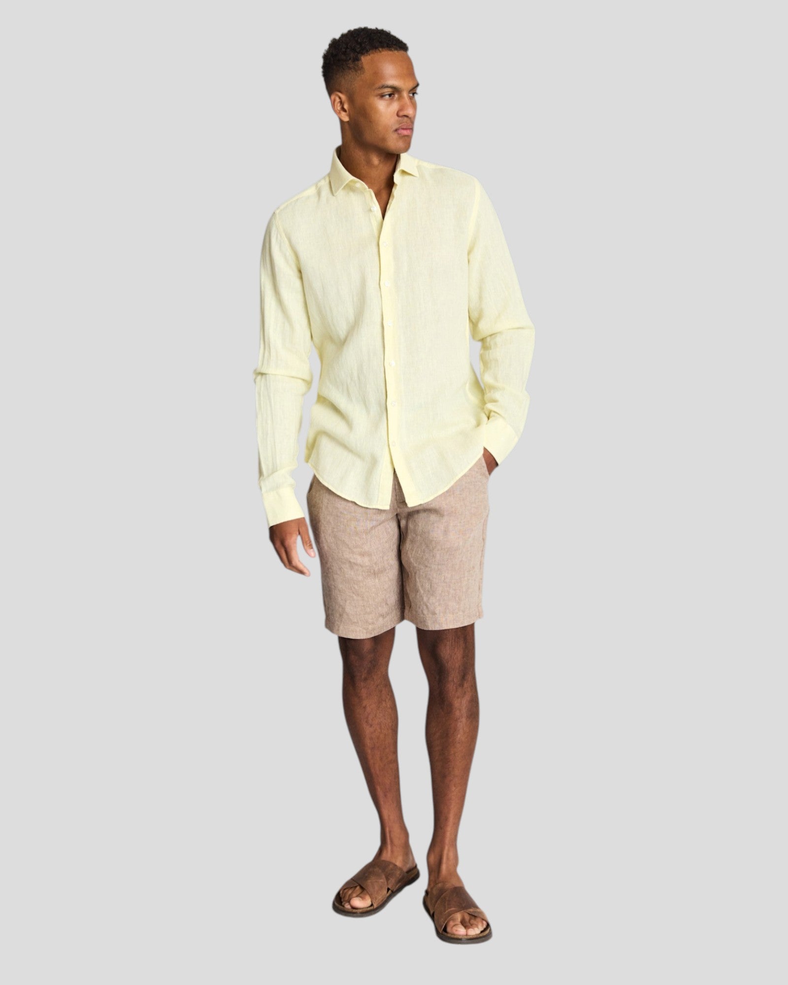Yellow Tahaka Modern Fit Shirt by Bruun & Stengade, casual style, shown on a hanger with a close-up of fabric texture.