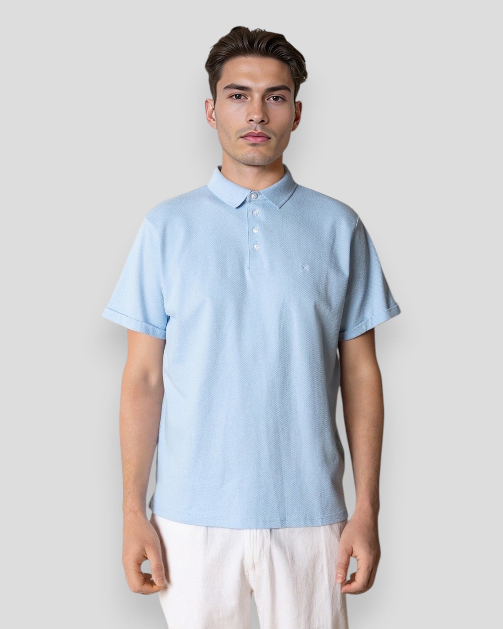 Light blue Silkeborg Stretch Polo by Clean Cut Copenhagen, showcasing the fitted polo shirt with a classic collar and short sleeves.