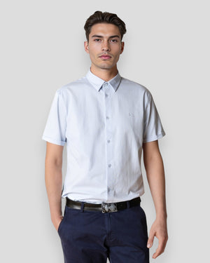Light blue Clean Cut Copenhagen formal stretch shirt for men, short-sleeve design with a tailored fit, shown on a hanger.