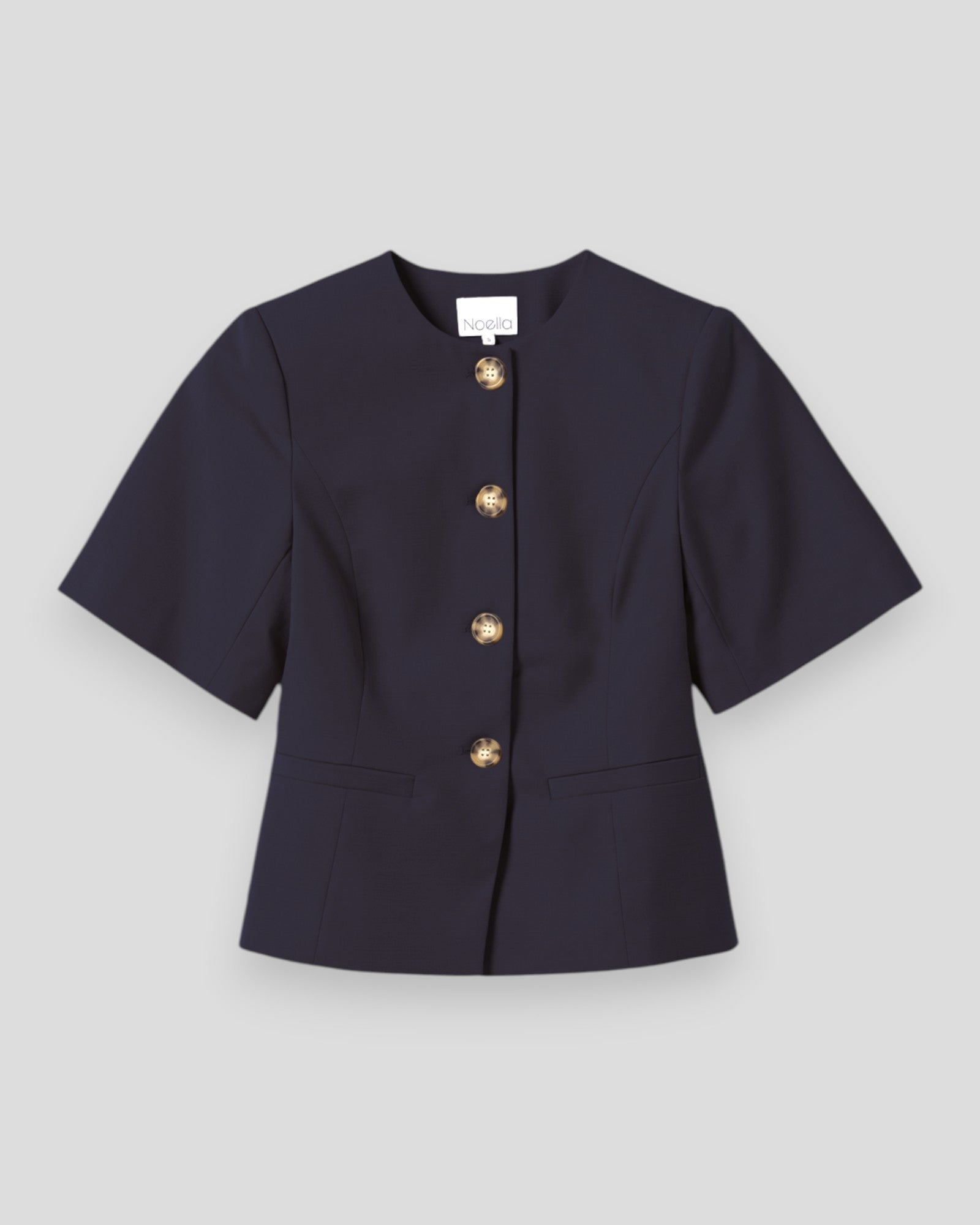 Navy women's blazer by Noella, featuring tailored fit and classic design, shown on a hanger with front view.