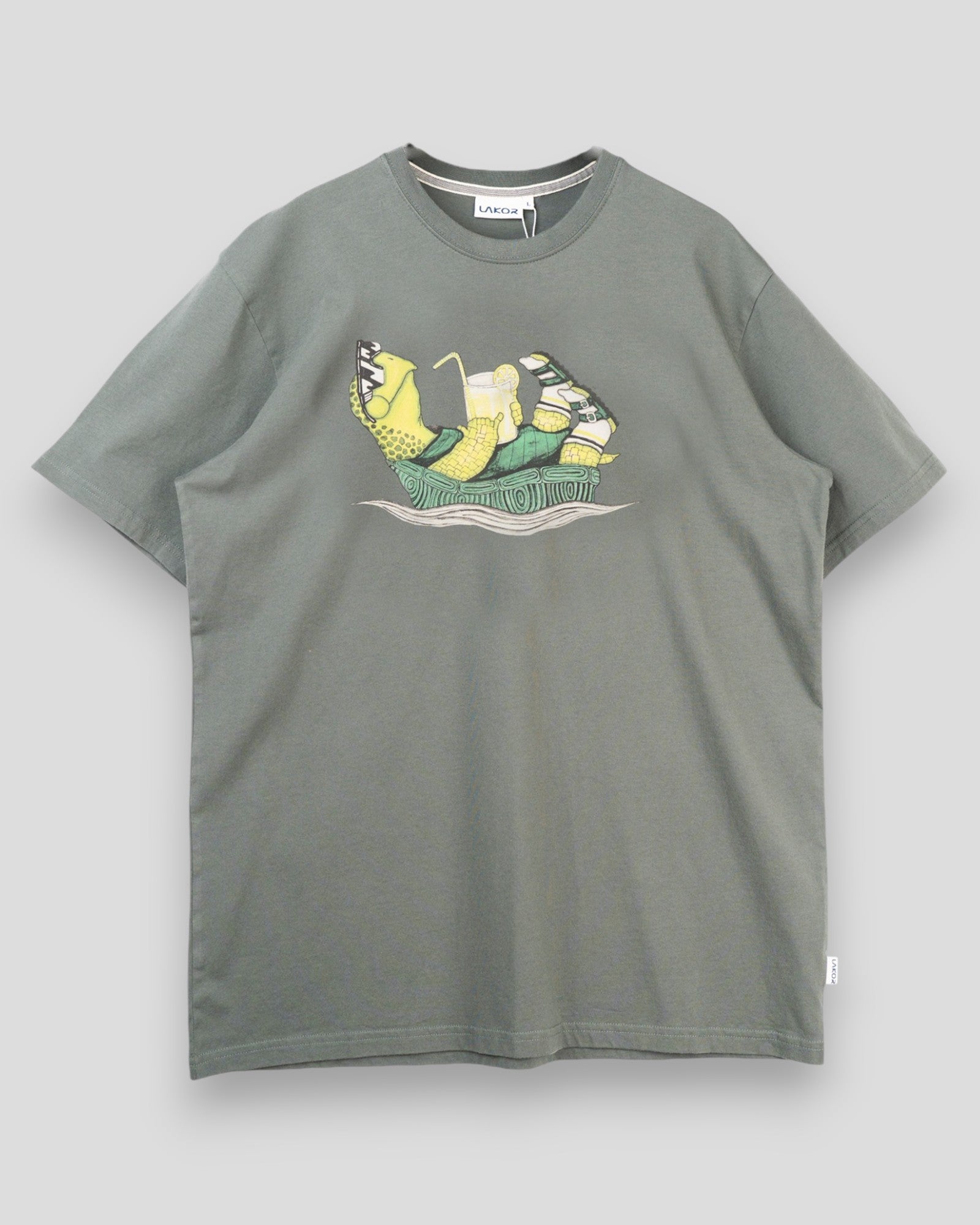 Lakor Slow Flow Tee in Urban Chic style, featuring a relaxed fit and soft fabric, displayed on a hanger with a neutral background.