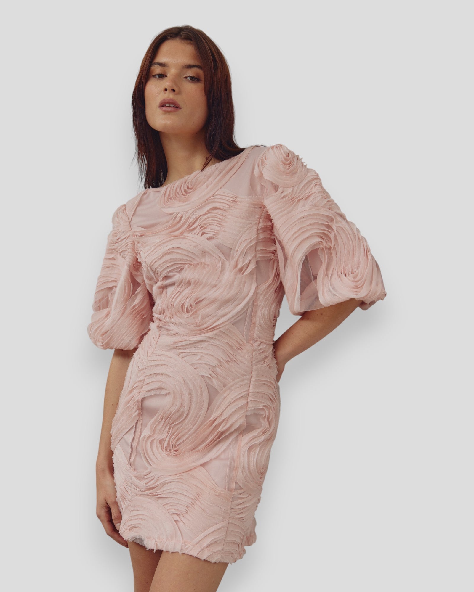 Noella N-Michaela Baby Pink Dress displayed on a hanger, showcasing its soft fabric and elegant design.
