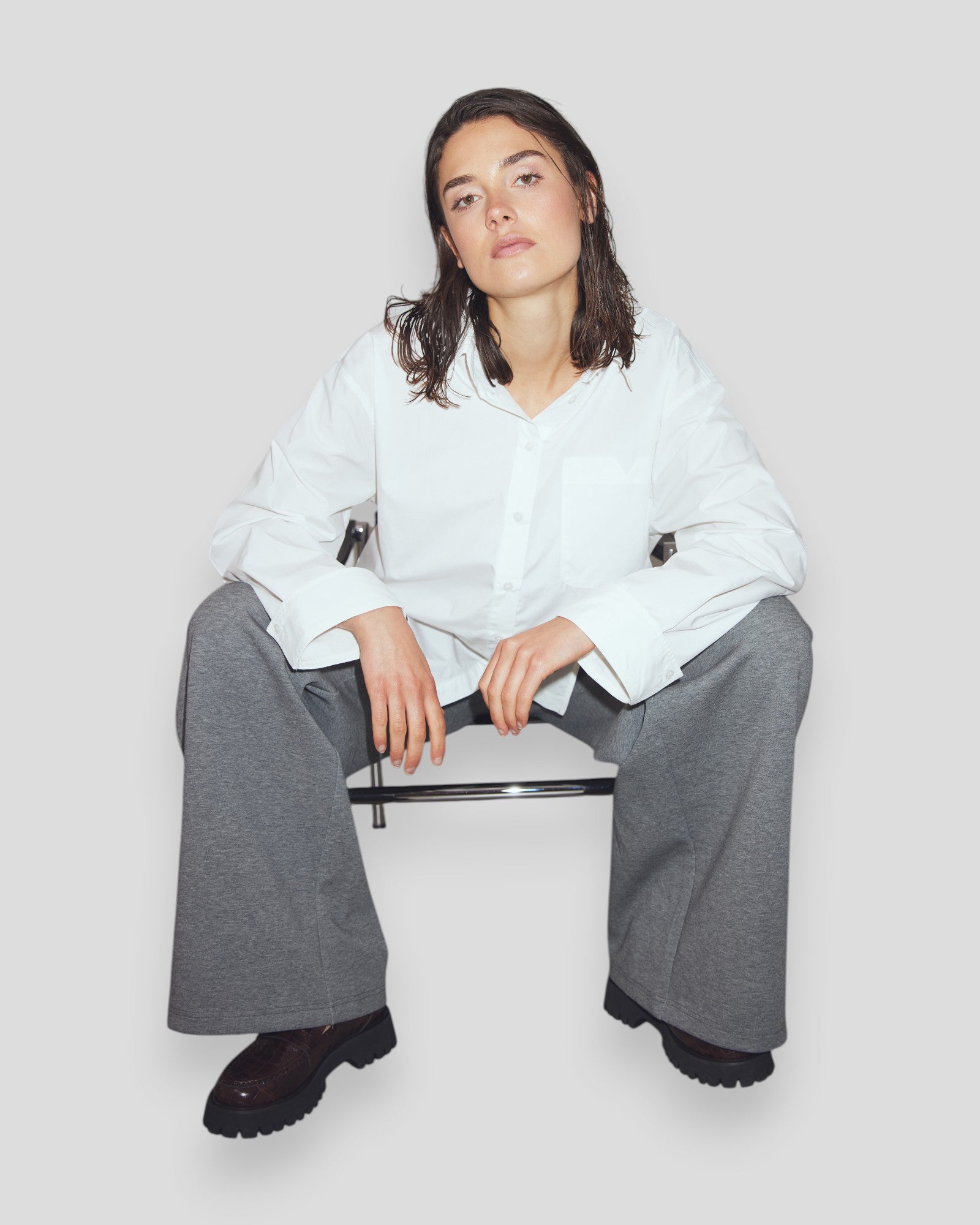 White N-Marlon women's shirt by Noella, shown on a model, featuring a stylish, casual fit with a classic collar and button closure.