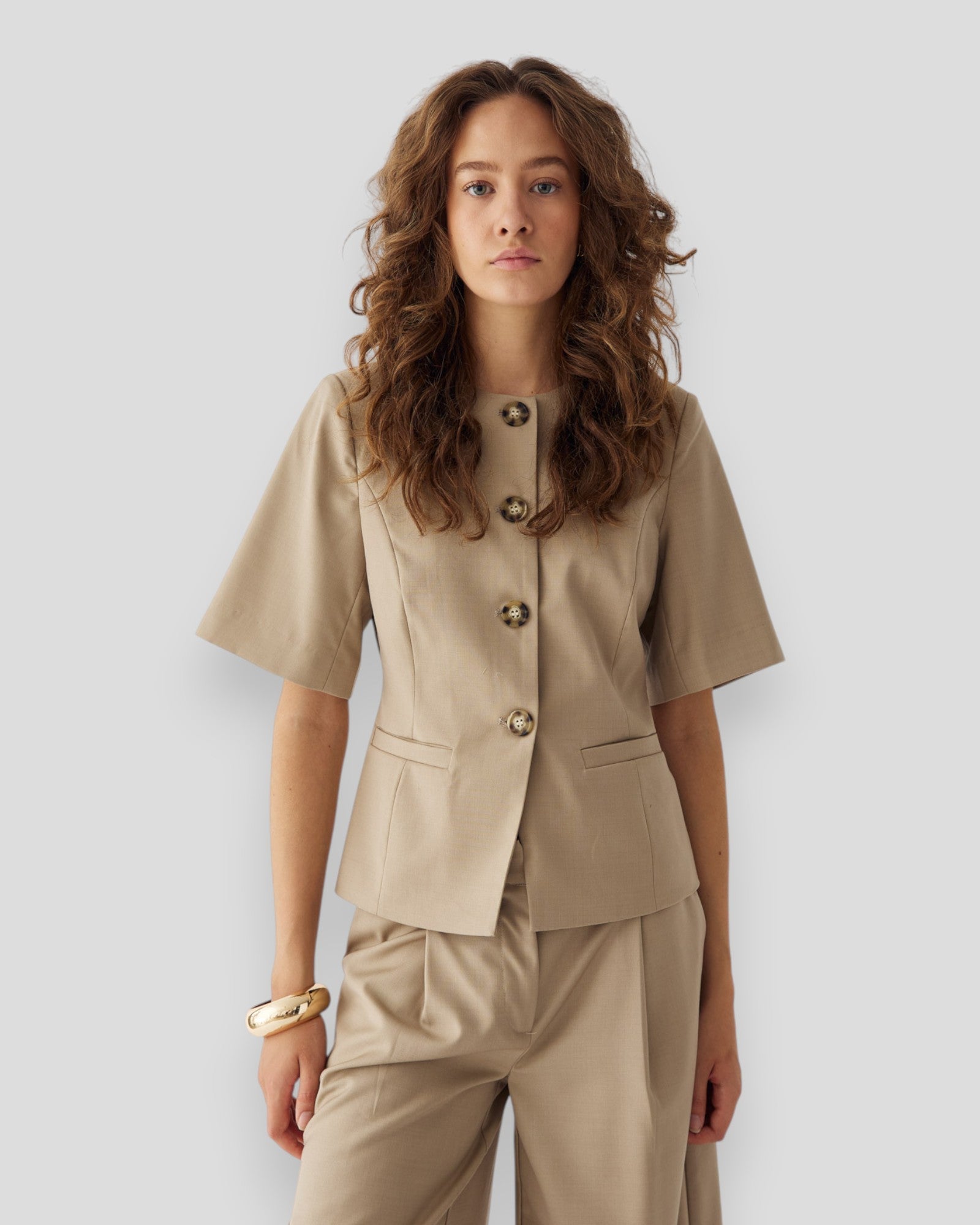 Noella Kasaundra women's blazer in oyster, tailored fit with lapels and long sleeves, stylish formal or casual jacket.