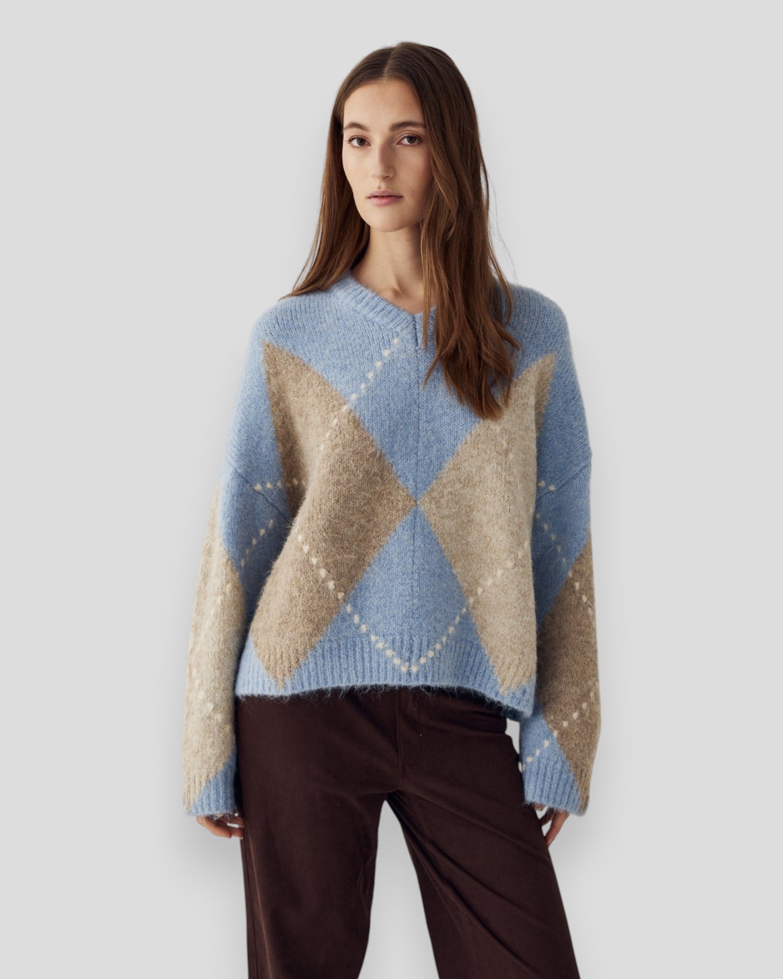 Sky blue mixed knit sweater for women by Noella, featuring a cozy and stylish knitted design.
