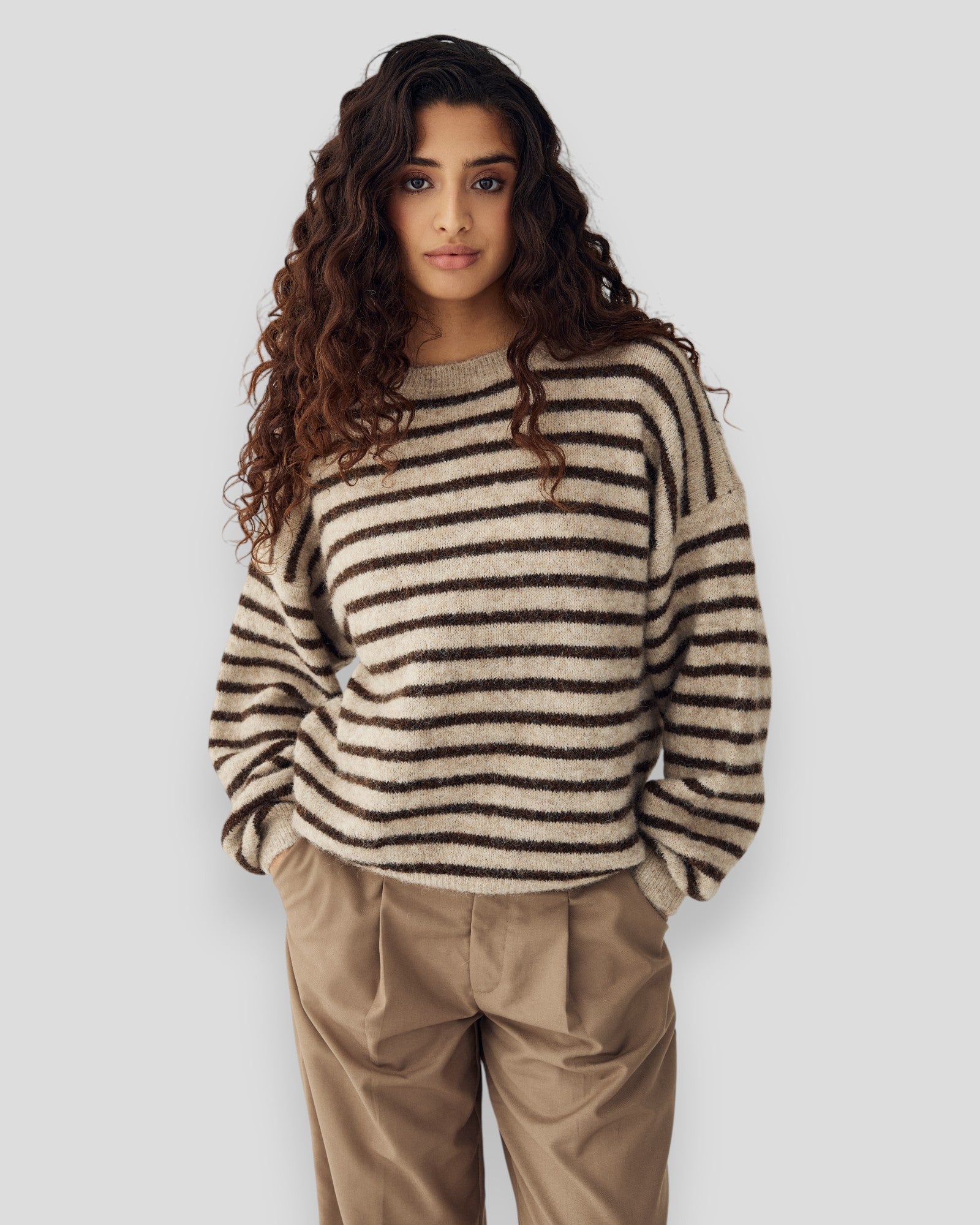 Brown sand striped women's knit sweater by Noella, featuring a cozy knit fabric and stylish striped pattern.