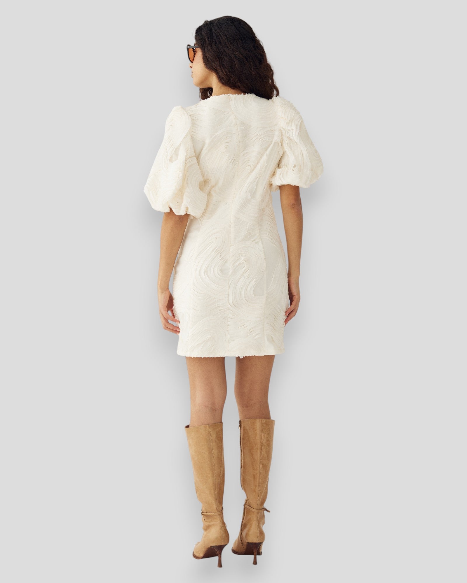 Noella N-Michaela Ivory Dress shown with flowing fabric and elegant design, perfect for stylish occasions.