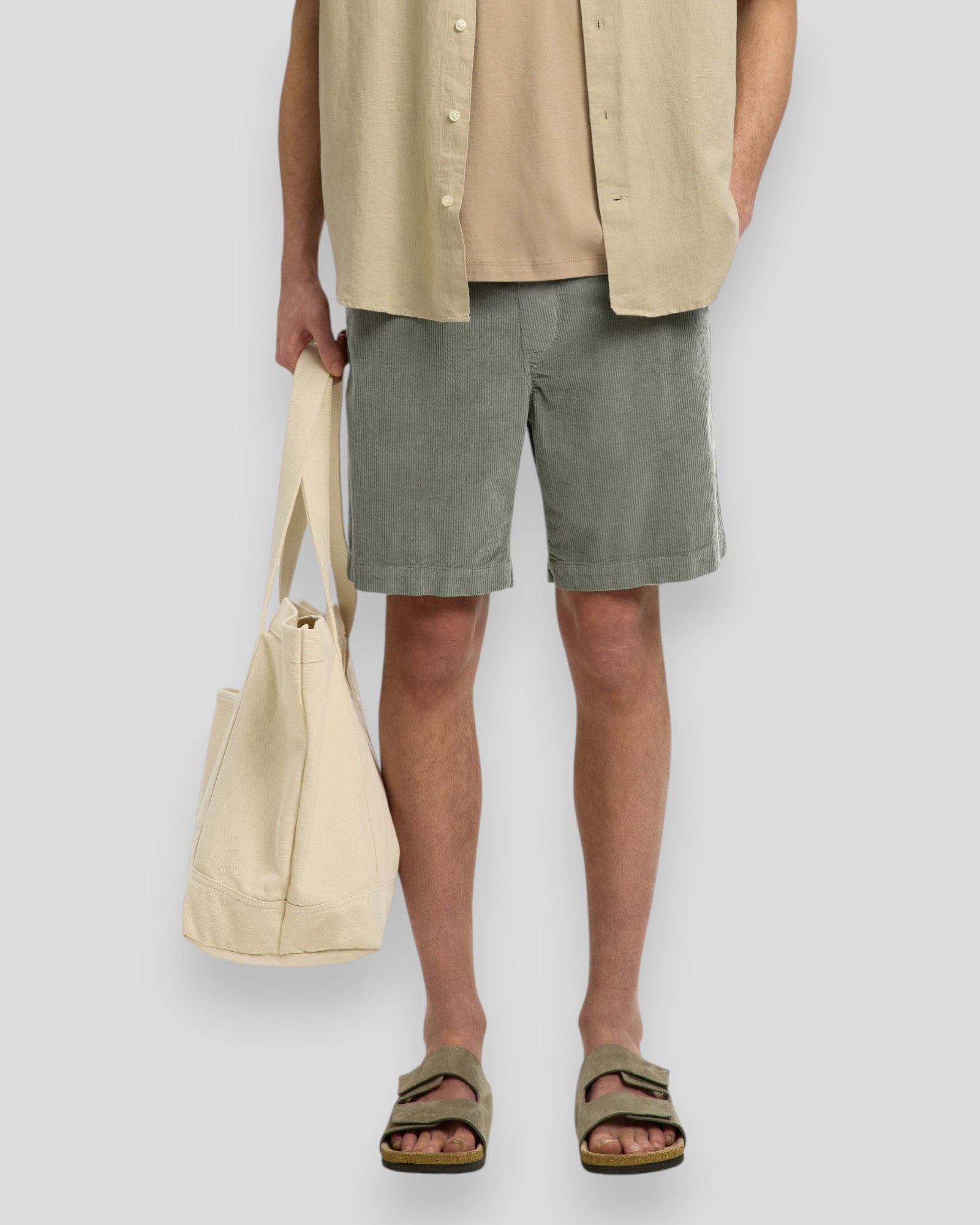 Men's regular Jace corduroy shorts in vetiver color, displayed flat with front pockets and belt loops.
