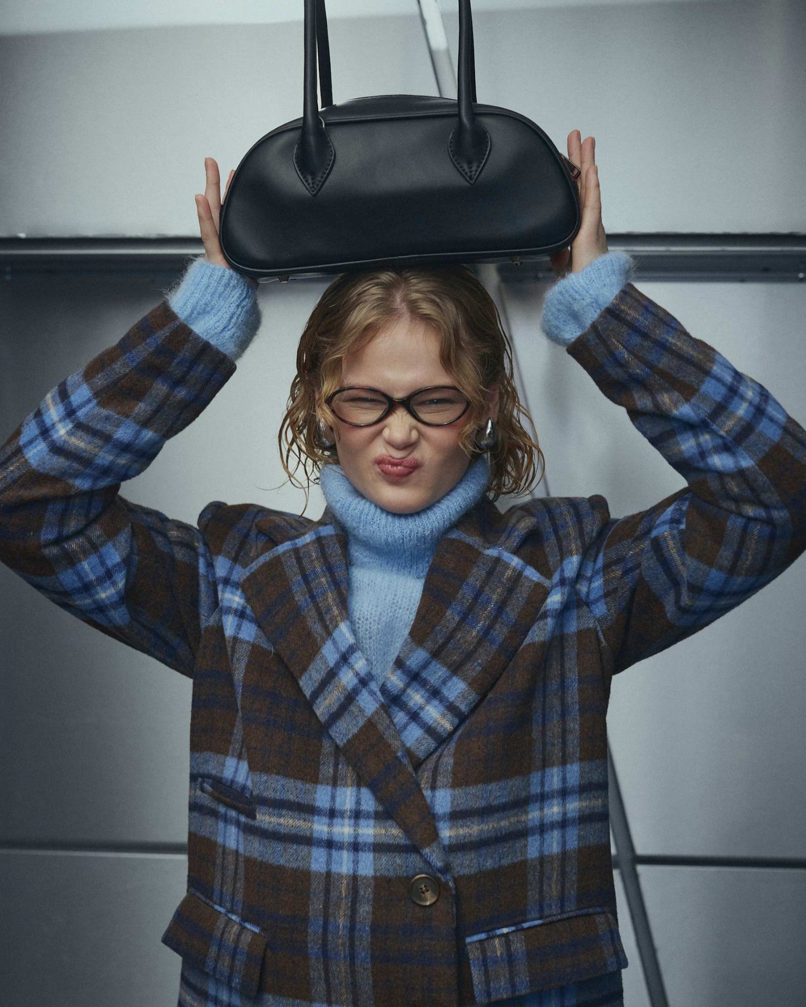 Black Noella Iris Bag for women, stylish and compact women's handbag with sleek design and top handle.