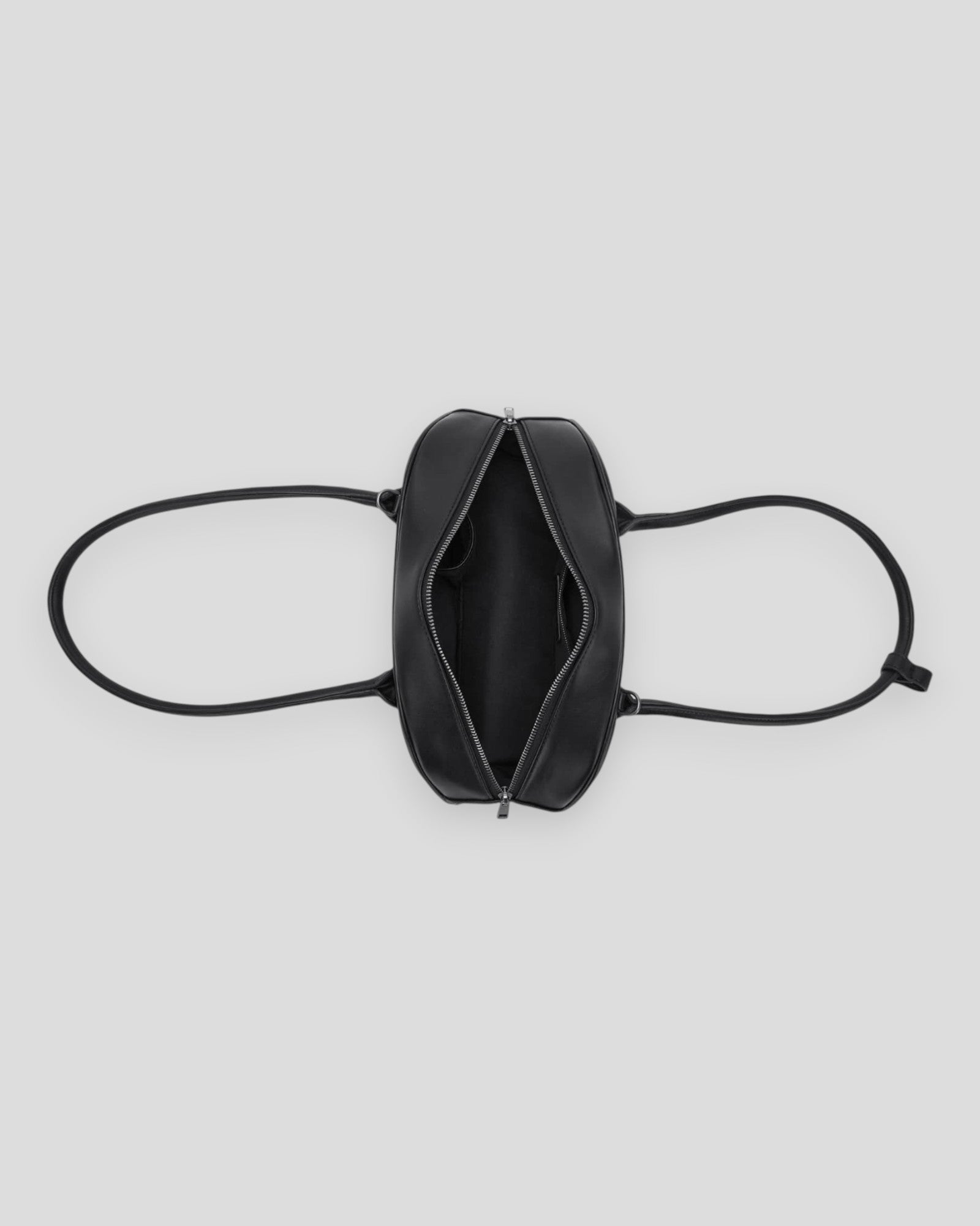 Noella Iris Bag in black for women, stylish handbag with sleek design and adjustable strap, perfect for everyday use.