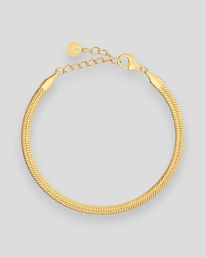 Guldherringbone armbånd til kvinder fra Edblad Dame, elegant og glat design i guldfarvet metal.